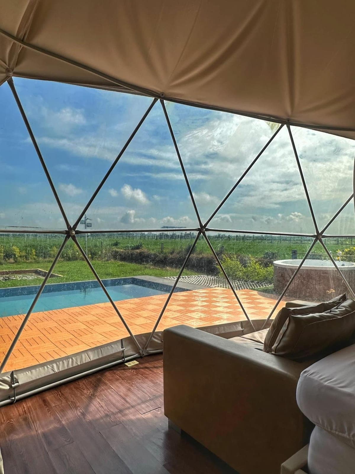 Dome 1: the view through the window to the pool and rice field