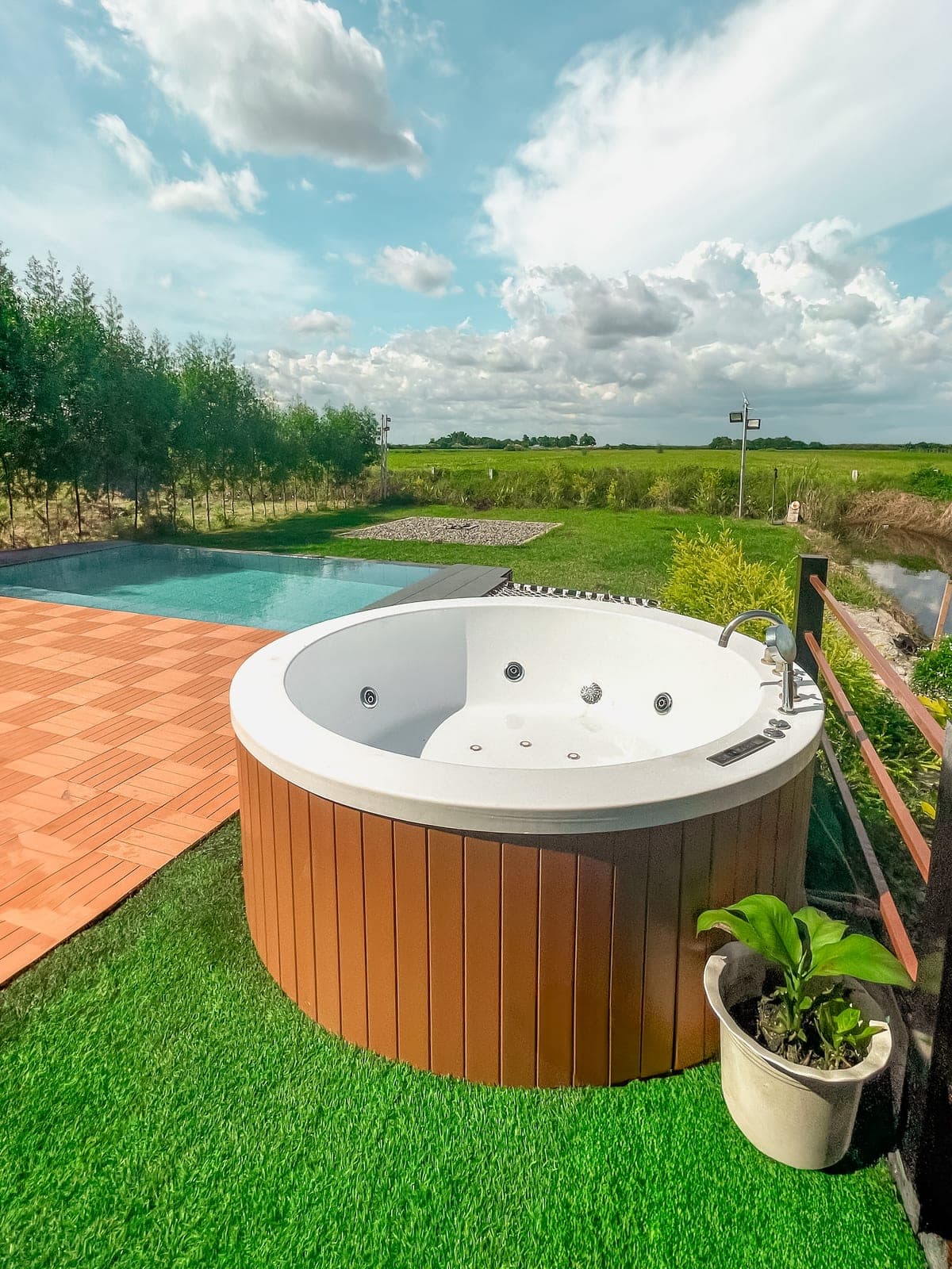 Dome 1: the heated jacuzzi and pool, with the rice field behind