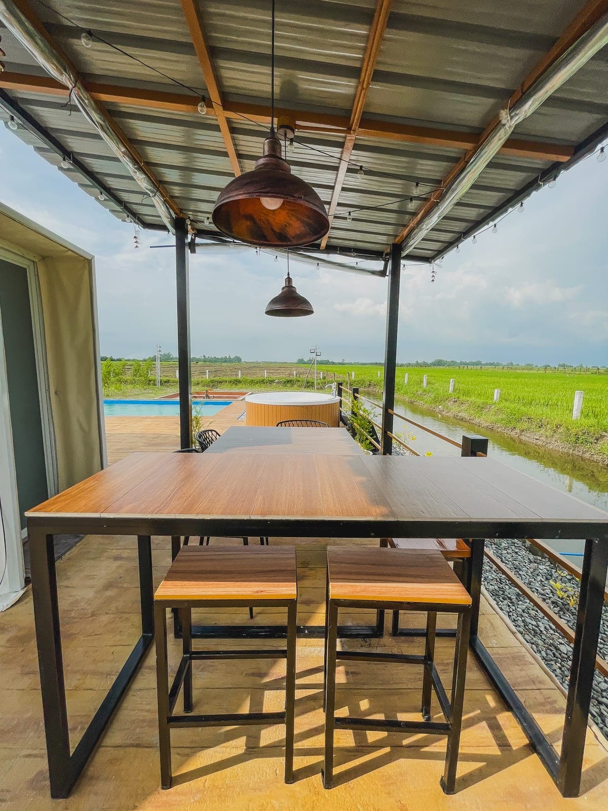Dome 1: the outdoor dining table looking over the pool