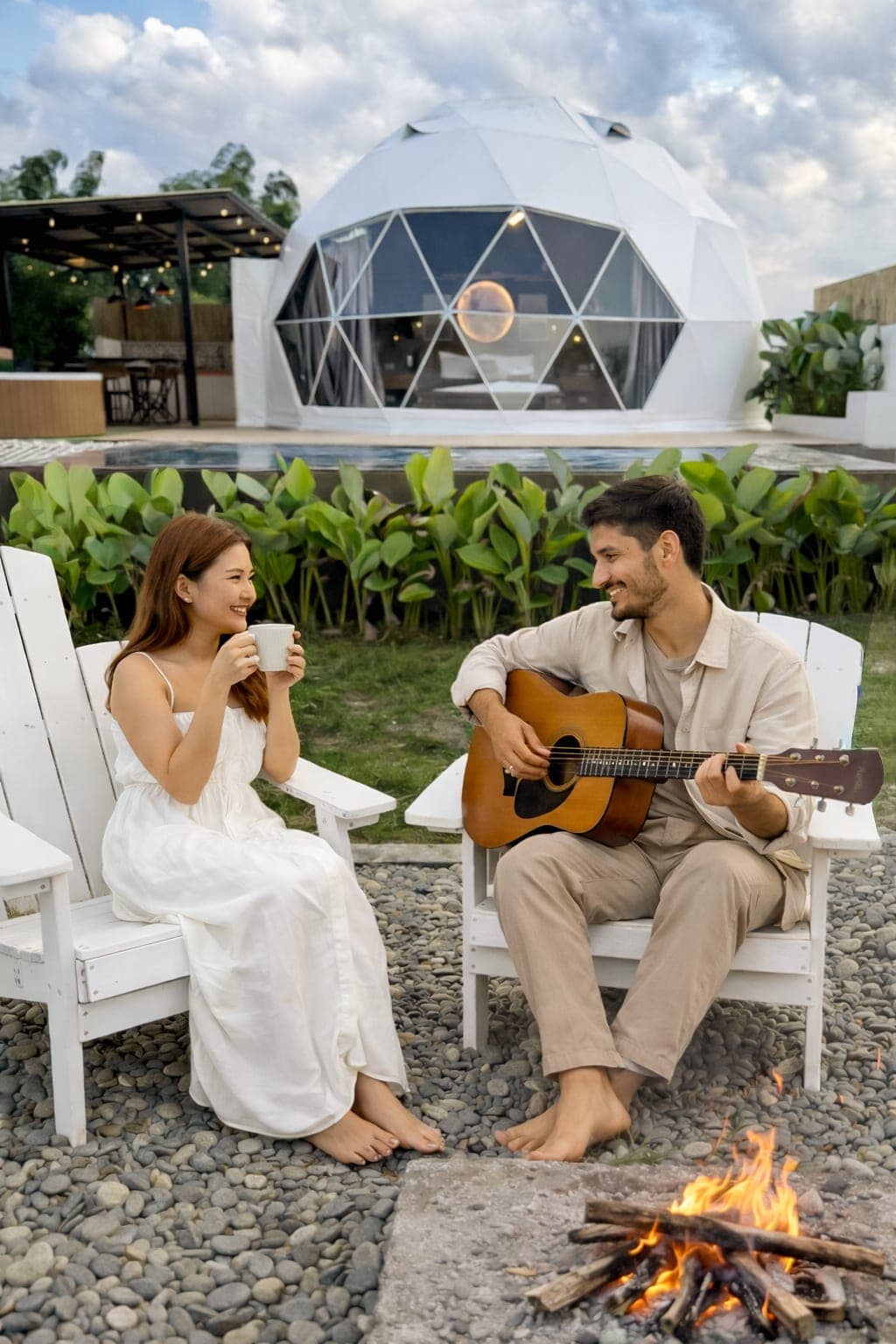 A group of guests on the lawn, one playing a guitar